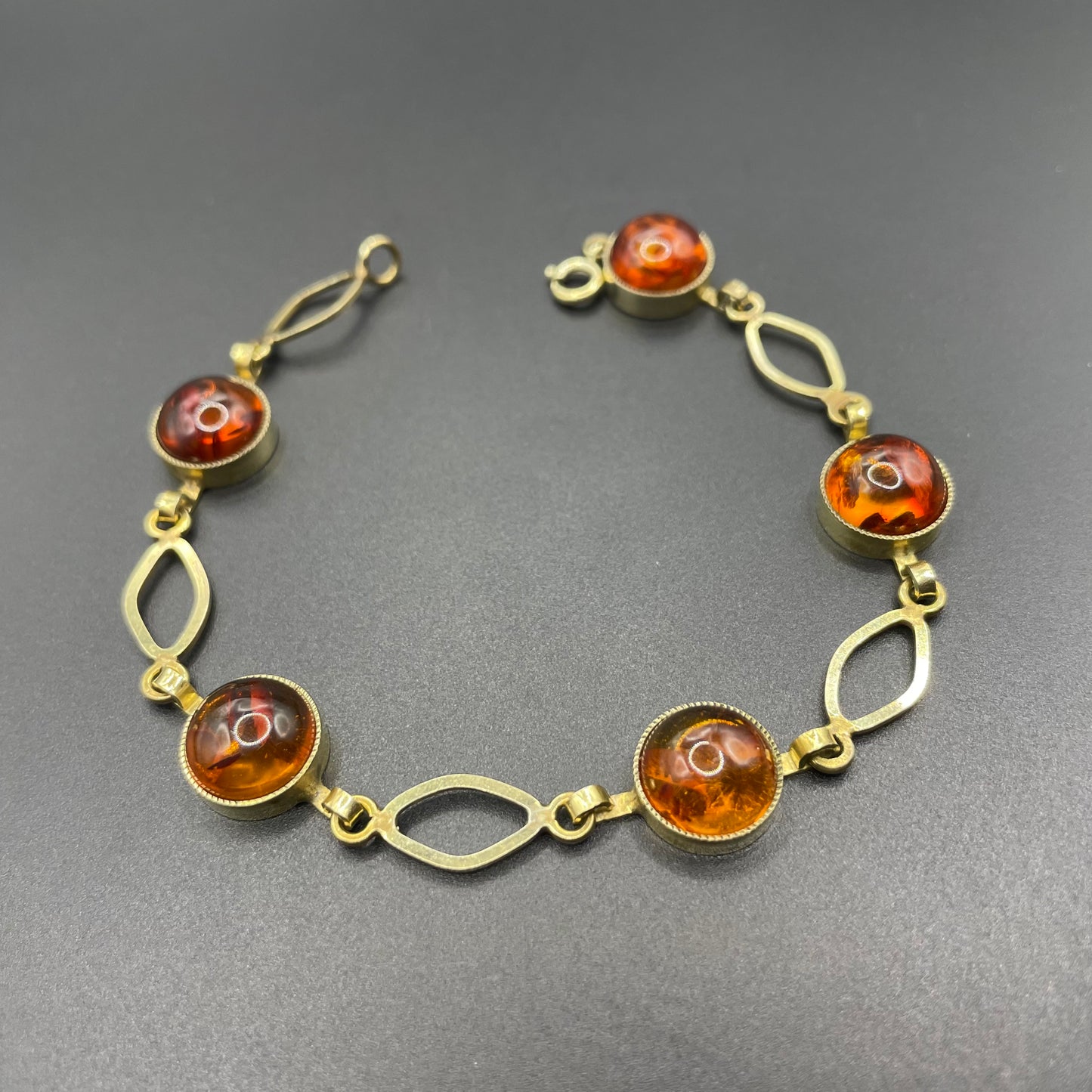 Vintage Art Deco 1920s / 1930s amber gemstone cabochon and gold tone bracelet, stamped AMR