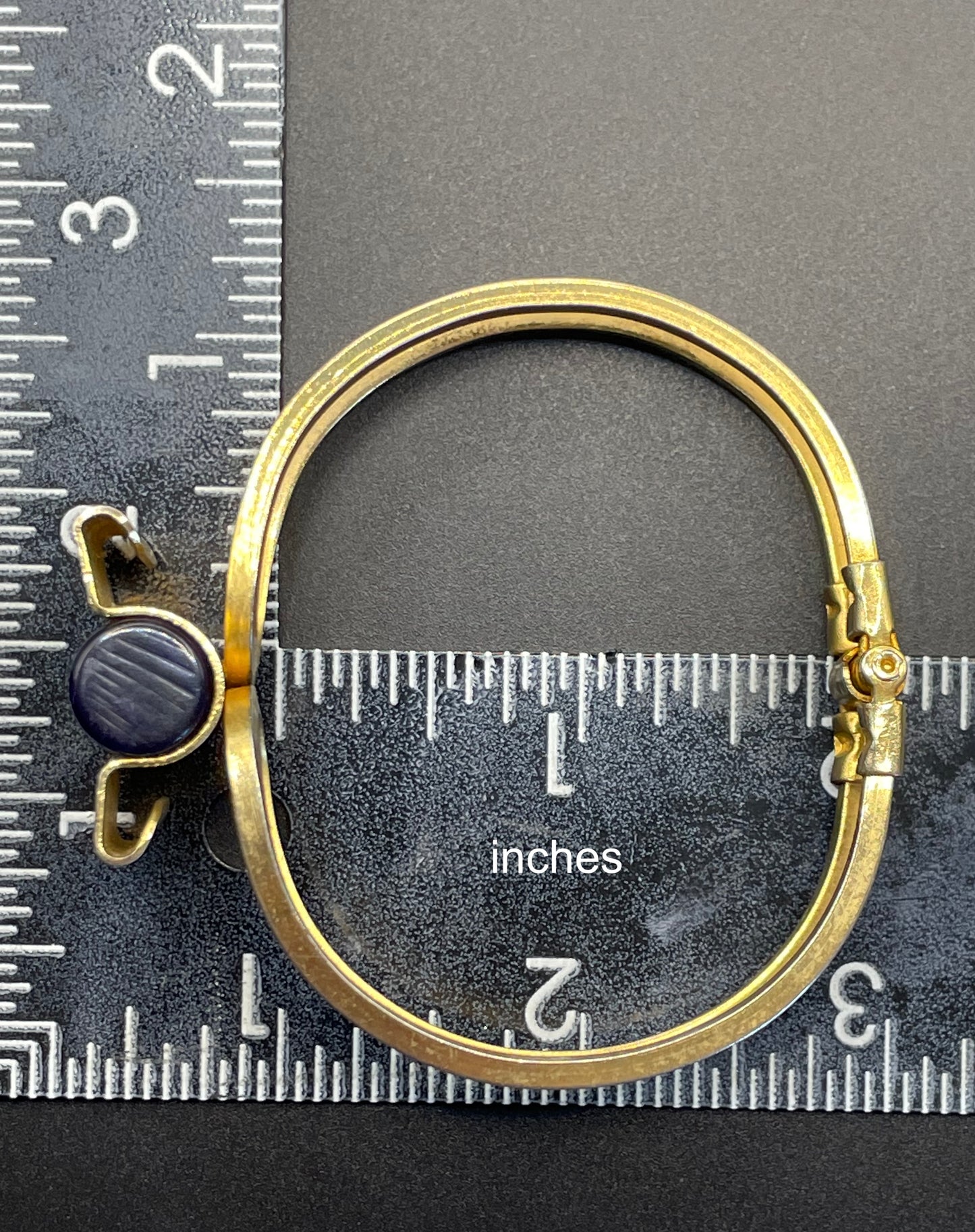 Vintage Jakob Bengel Art Deco machine age clamper bangle in shiny gold tone with a rich blue galalith cylinder