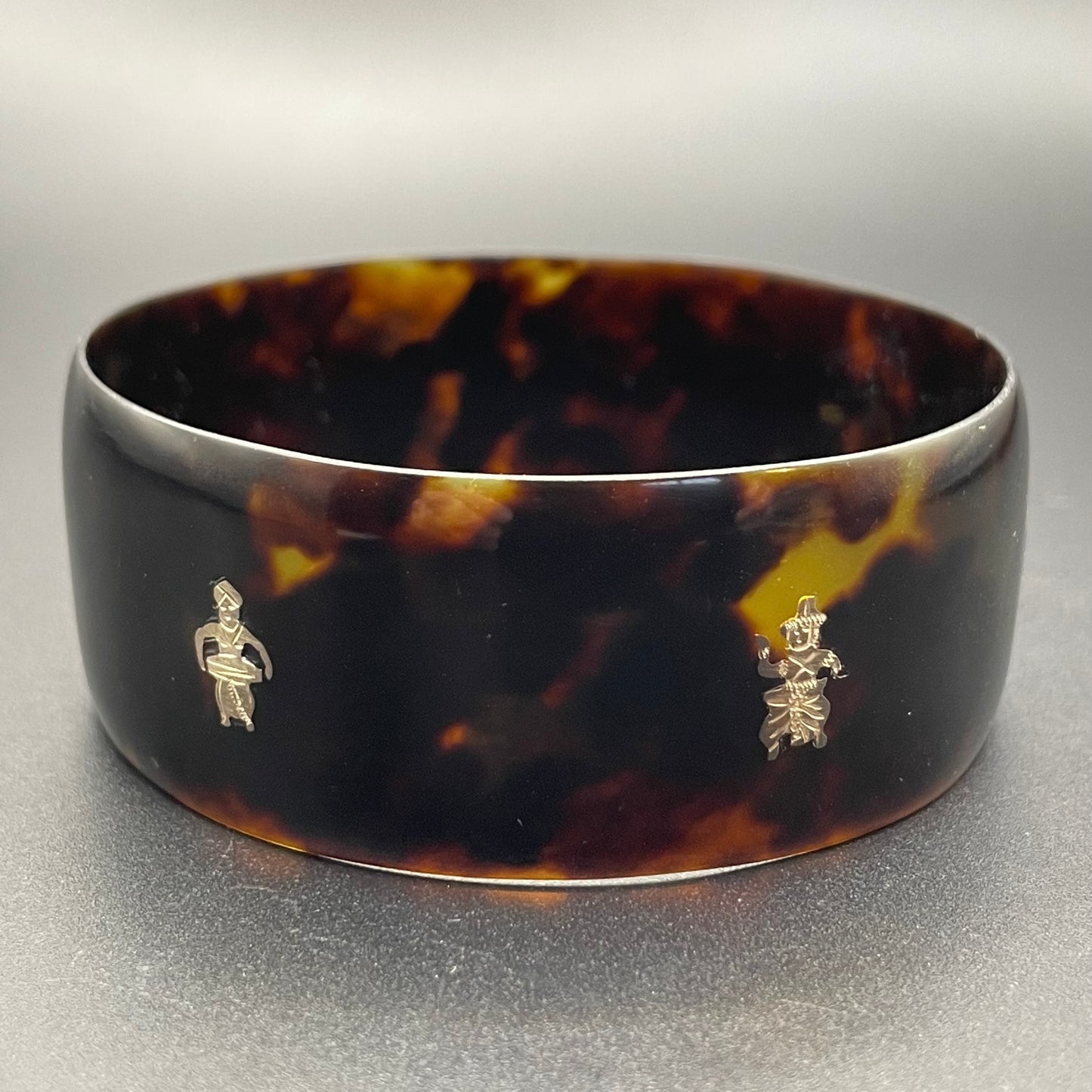 Antique tortoiseshell and silver piqué work bangle, perhaps souvenir of South Asia, figures and an elephant depicted