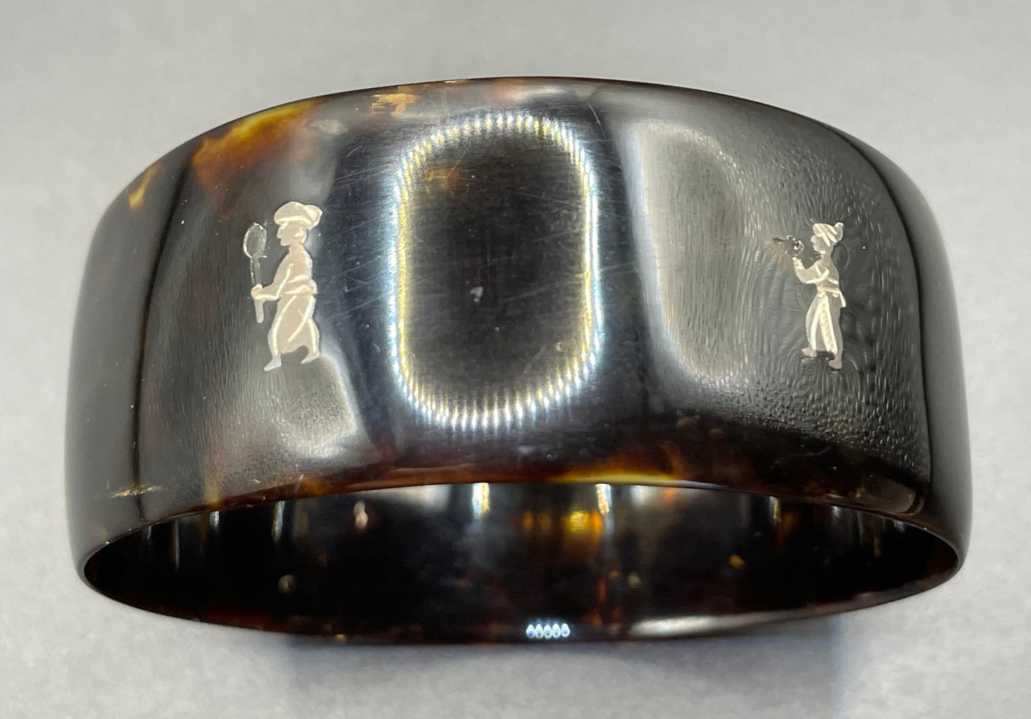 Antique tortoiseshell and silver piqué work bangle, perhaps souvenir of South Asia, figures and an elephant depicted