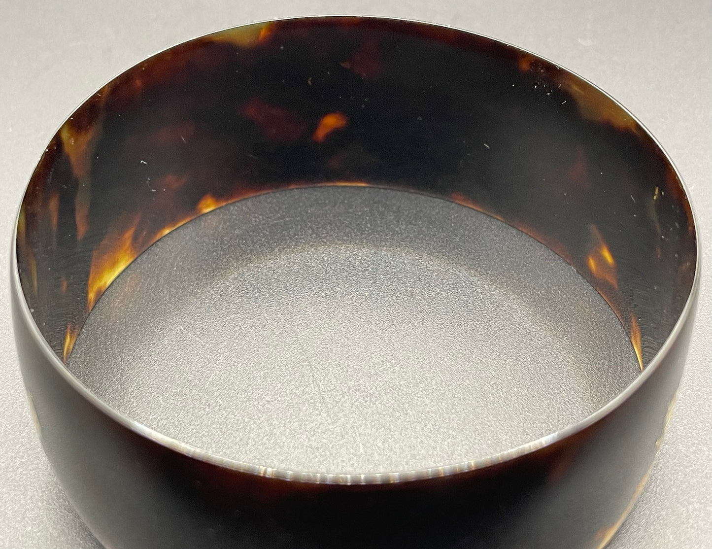 Antique tortoiseshell and silver piqué work bangle, perhaps souvenir of South Asia, figures and an elephant depicted