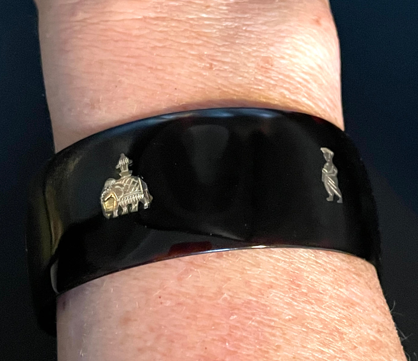 Antique tortoiseshell and silver piqué work bangle, perhaps souvenir of South Asia, figures and an elephant depicted