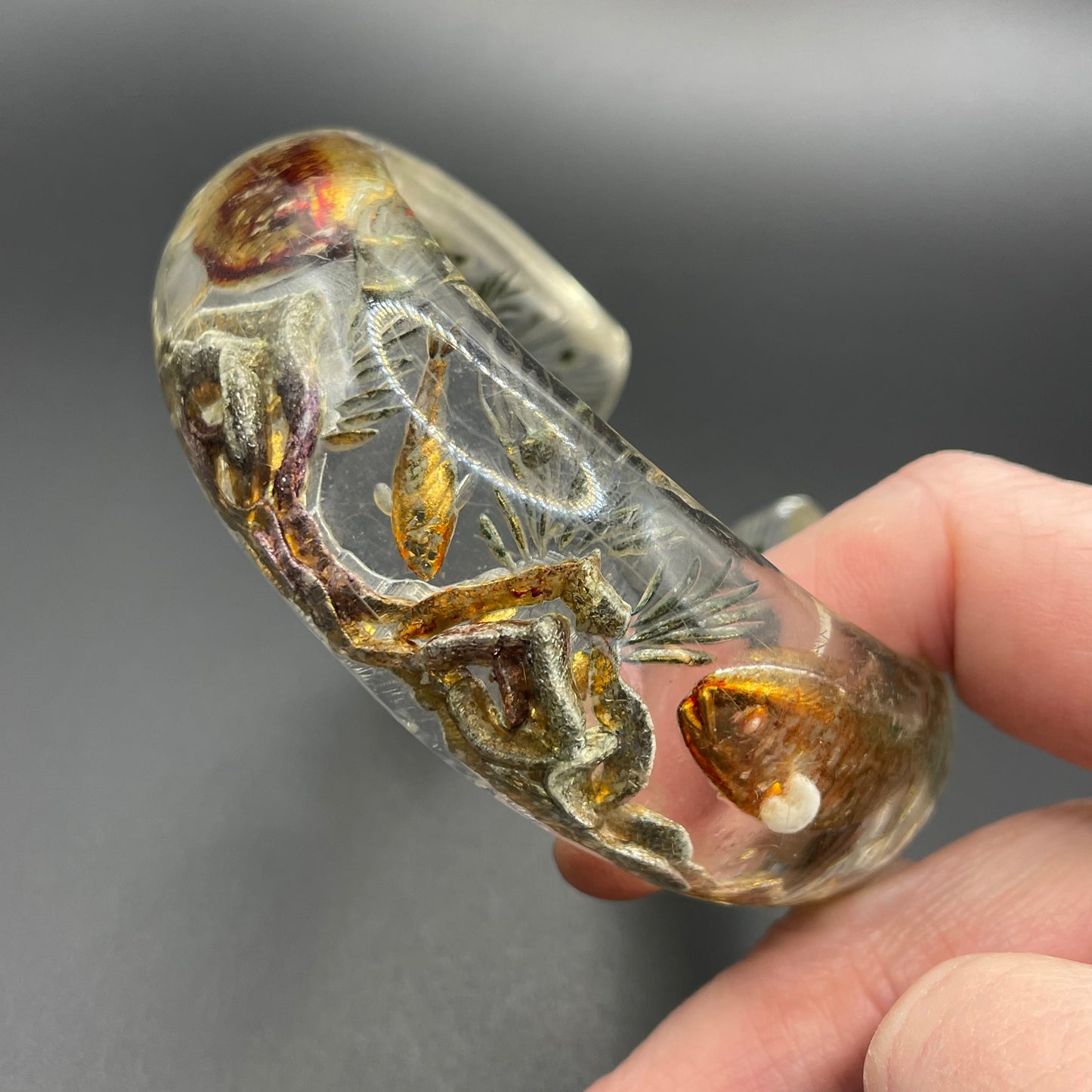 Rare Dunhill Aquarium reverse carved lucite cuff bangle, companion to the aquarium lighters from around 1950