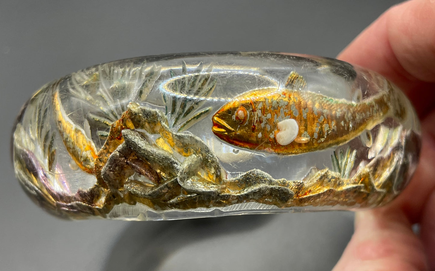 Rare Dunhill Aquarium reverse carved lucite cuff bangle, companion to the aquarium lighters from around 1950