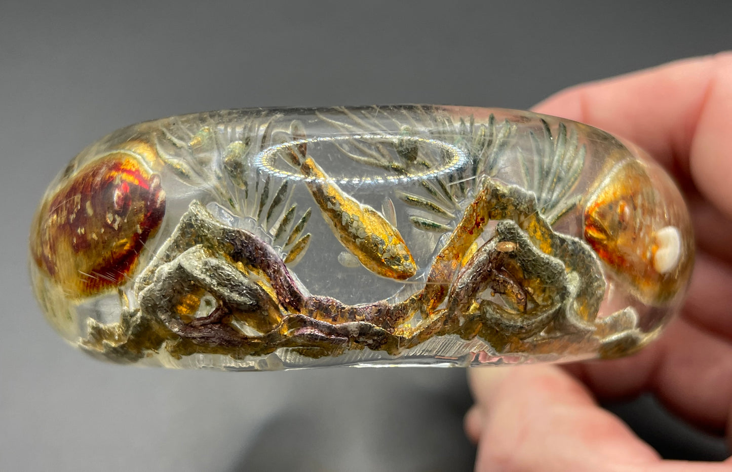 Rare Dunhill Aquarium reverse carved lucite cuff bangle, companion to the aquarium lighters from around 1950