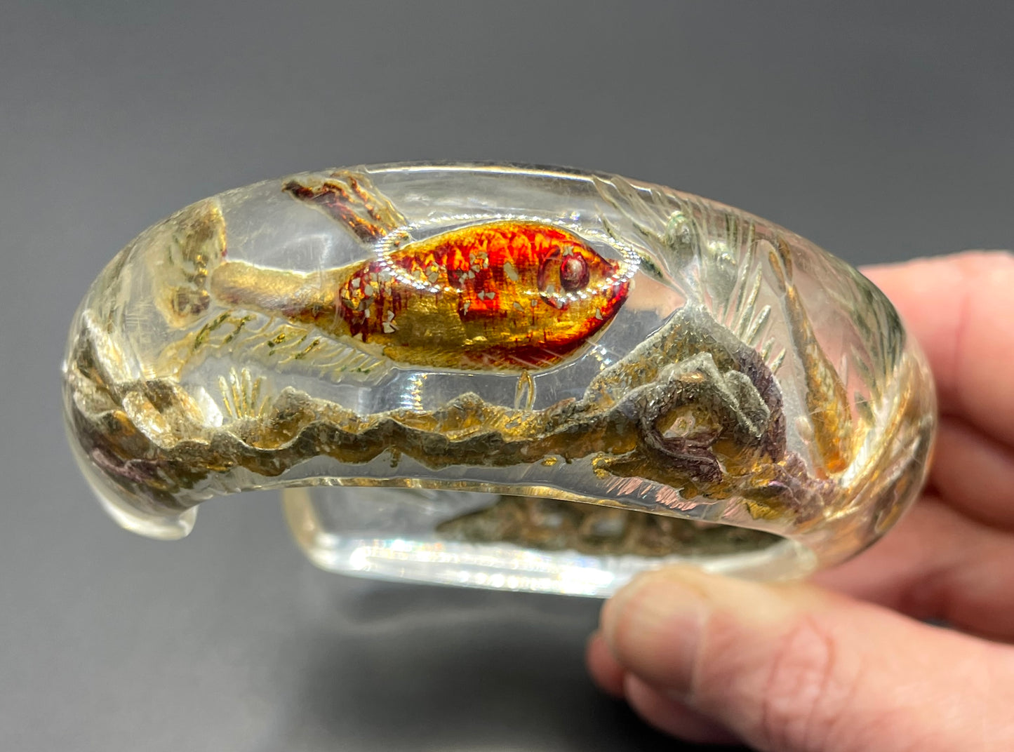 Rare Dunhill Aquarium reverse carved lucite cuff bangle, companion to the aquarium lighters from around 1950