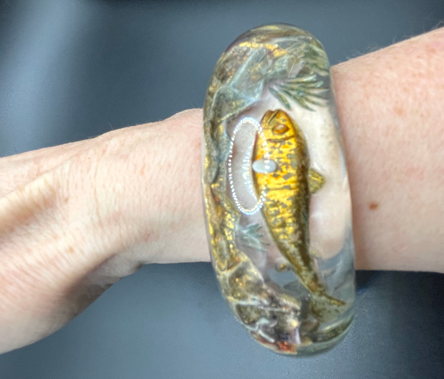 Rare Dunhill Aquarium reverse carved lucite cuff bangle, companion to the aquarium lighters from around 1950