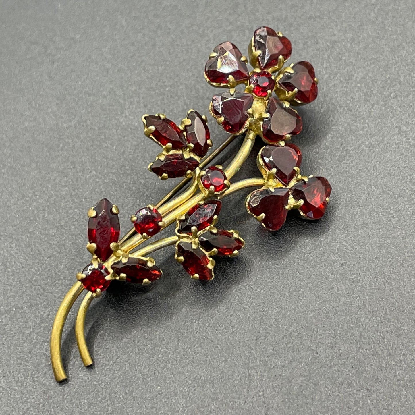 Vintage Art Deco Czech red garnet glass flower bouquet brooch, unusual heart-shaped rhinestones, set open-backed in gold tone