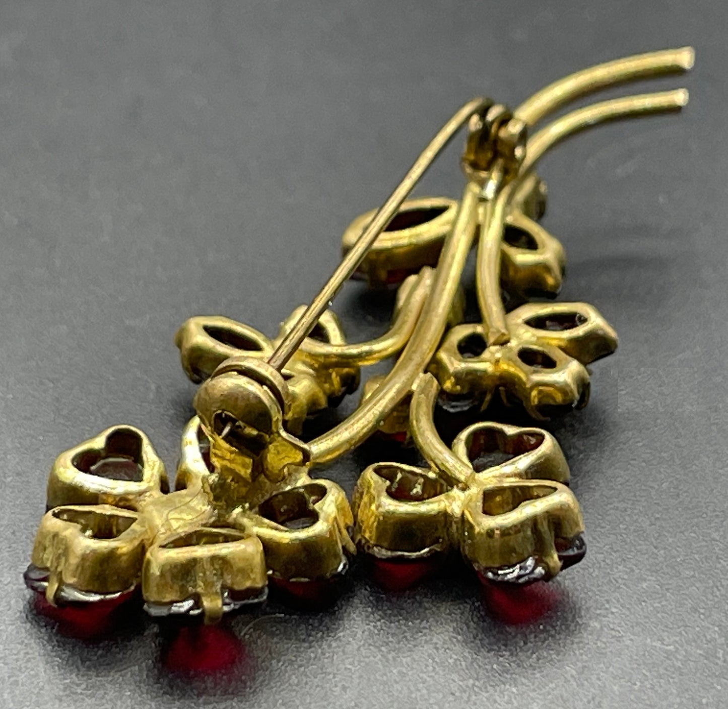 Vintage Art Deco Czech red garnet glass flower bouquet brooch, unusual heart-shaped rhinestones, set open-backed in gold tone