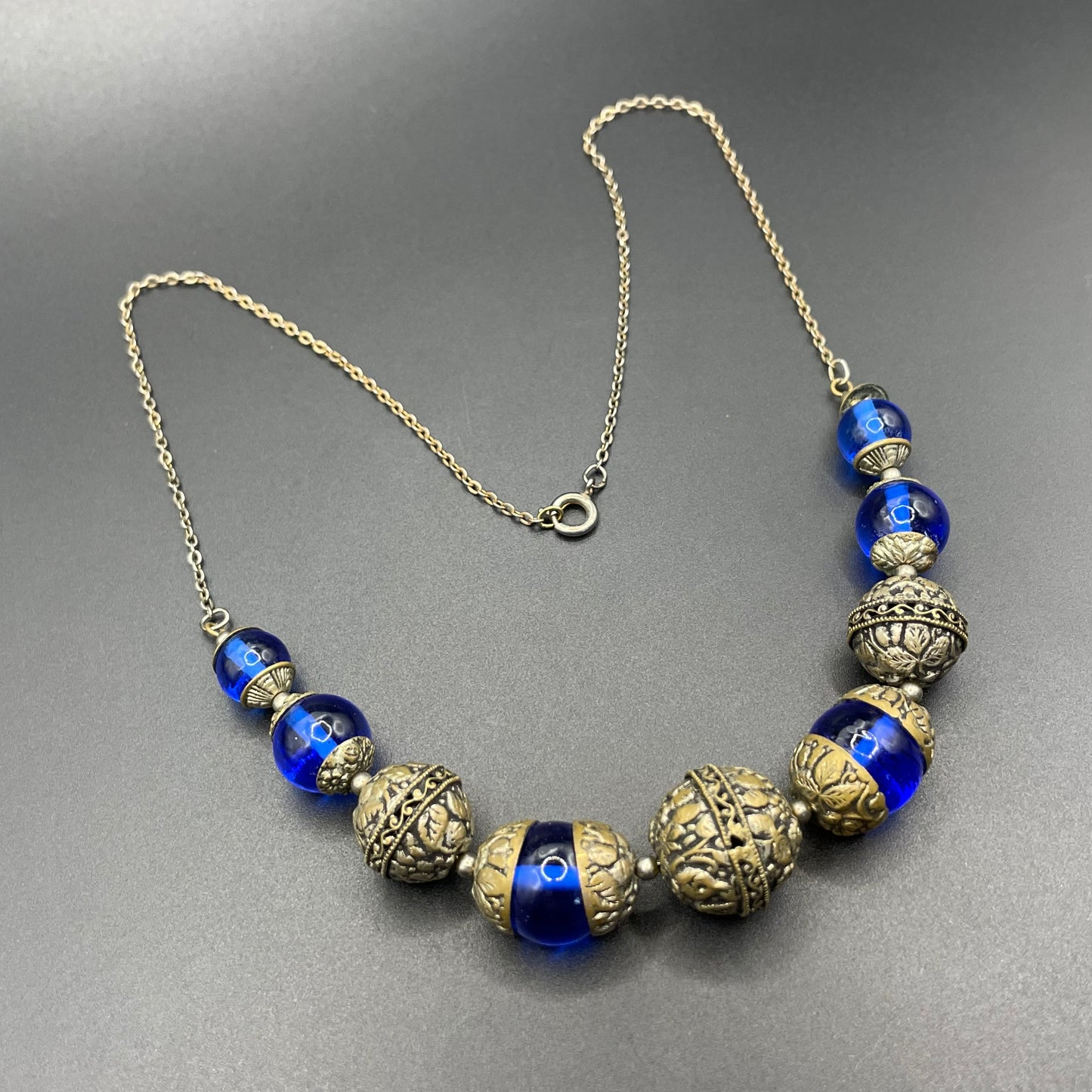 Vintage Bristol blue glass Art Deco necklace - brass chain, beads and ornate floral bead caps