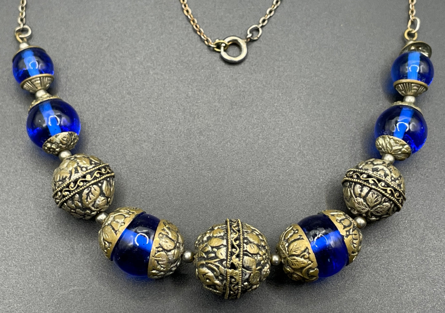 Vintage Bristol blue glass Art Deco necklace - brass chain, beads and ornate floral bead caps