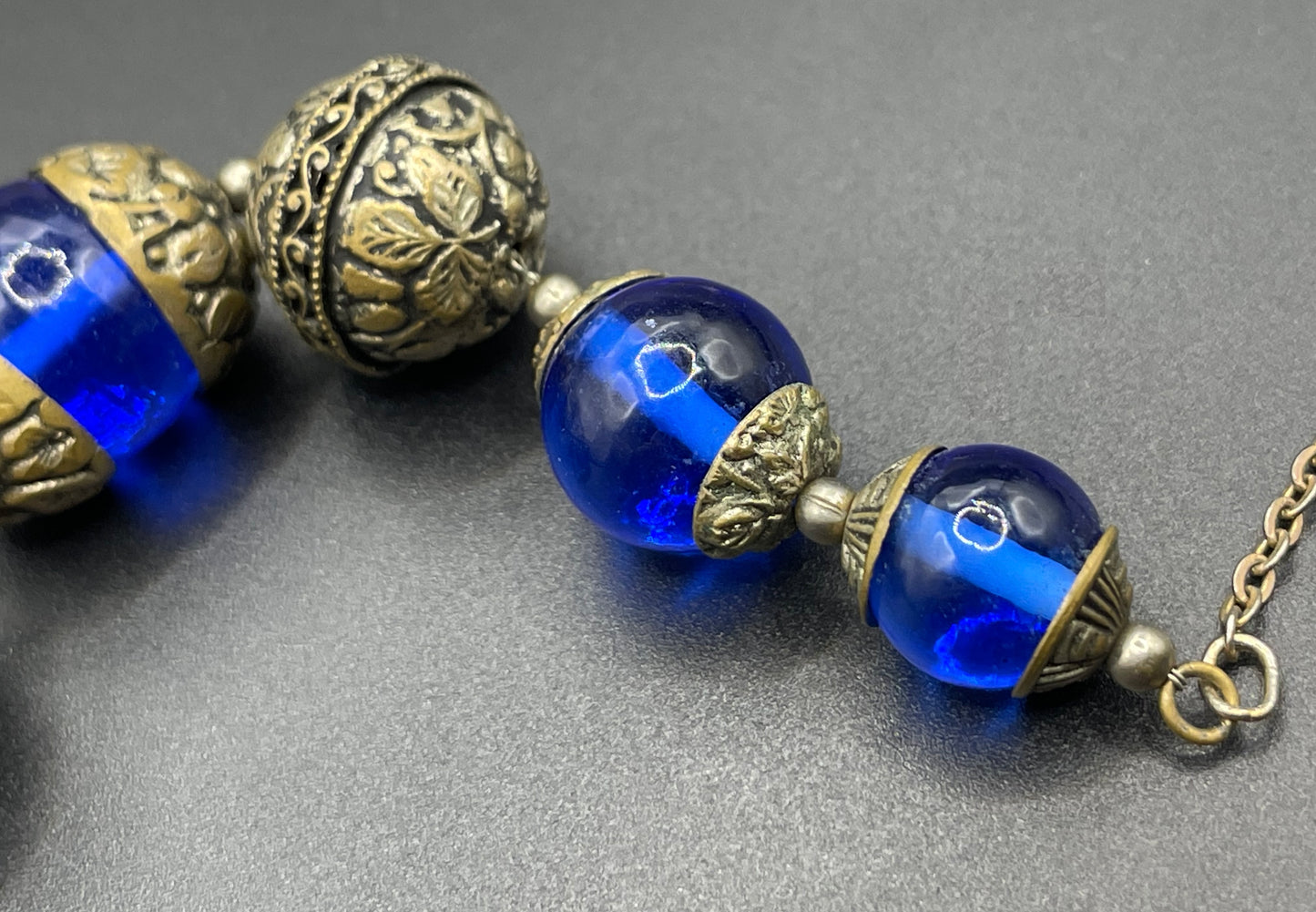 Vintage Bristol blue glass Art Deco necklace - brass chain, beads and ornate floral bead caps