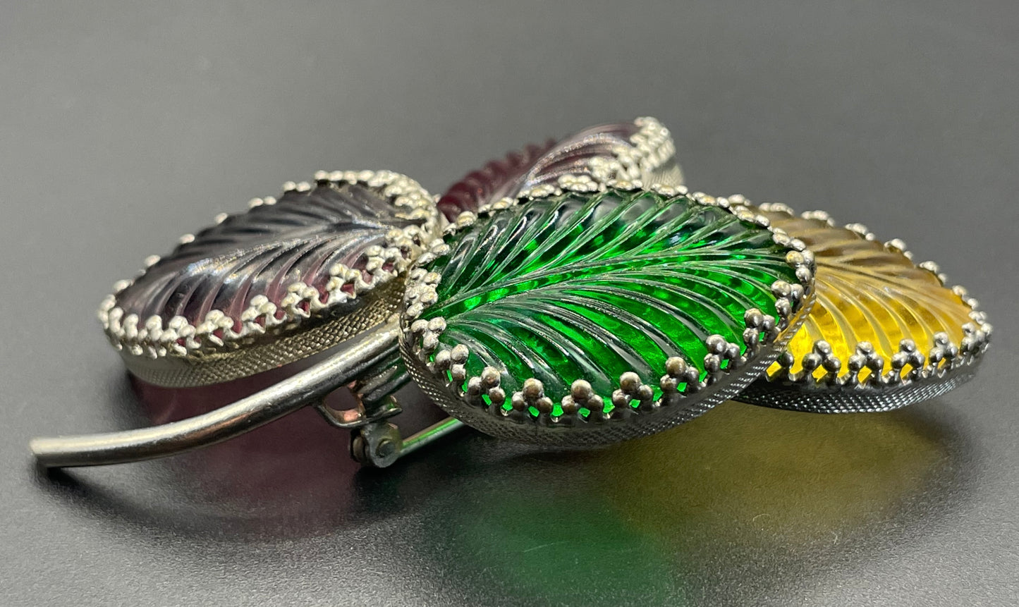 Vintage unsigned Schreiner ? pressed glass cabochon leaf brooch set in silver tone, vibrant red, yellow, green and purple crystals