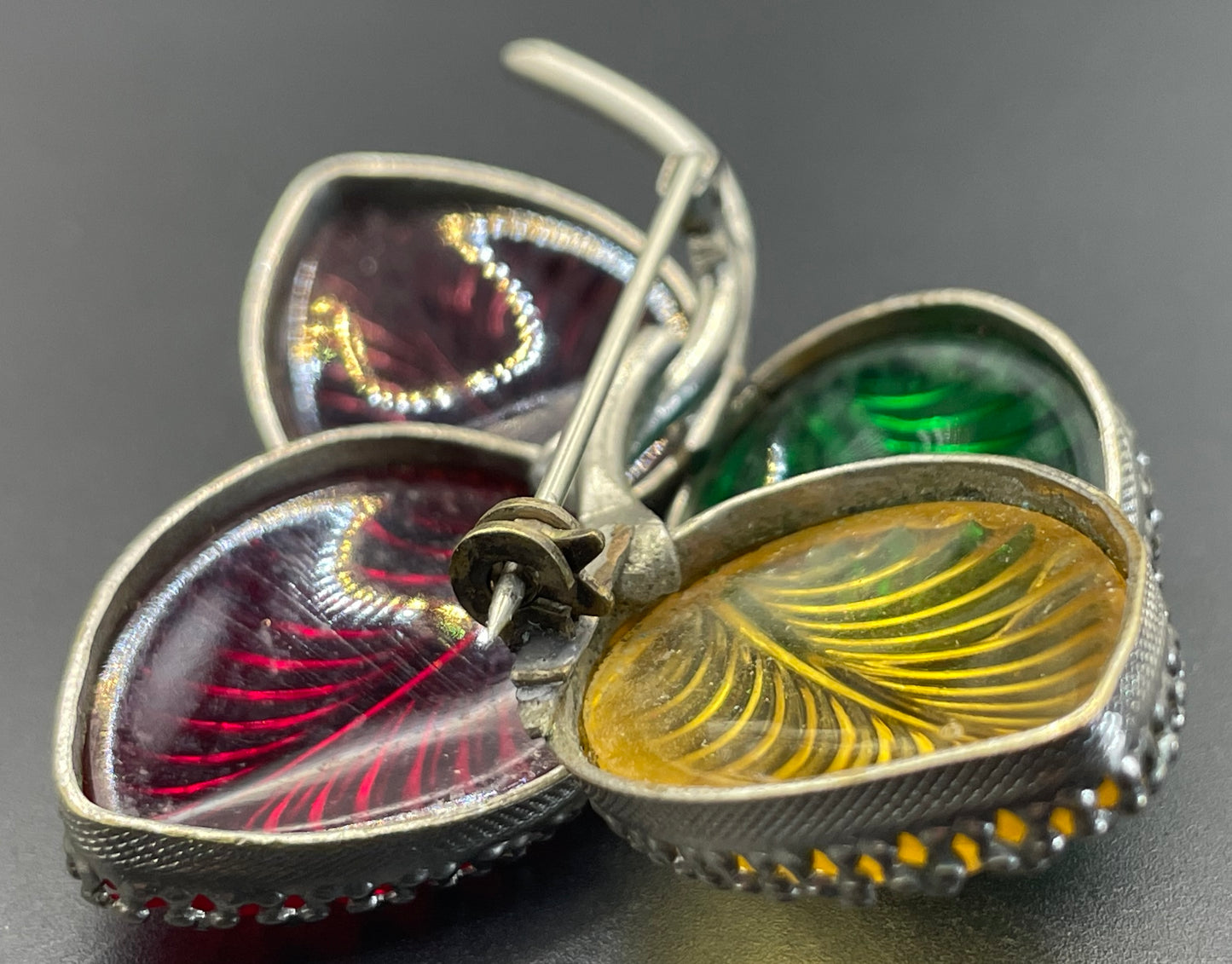 Vintage unsigned Schreiner ? pressed glass cabochon leaf brooch set in silver tone, vibrant red, yellow, green and purple crystals
