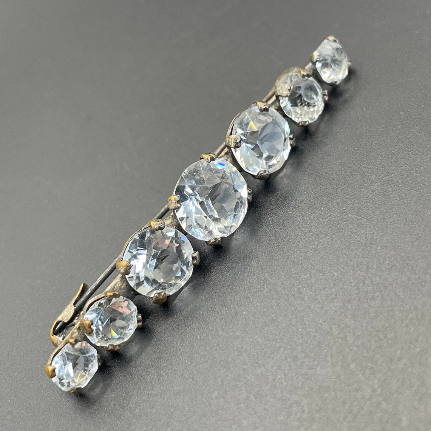 Vintage Art Deco bezel set clear crystal riviere rhinestone bar brooch, open-backed rhinestones in antique gold tone