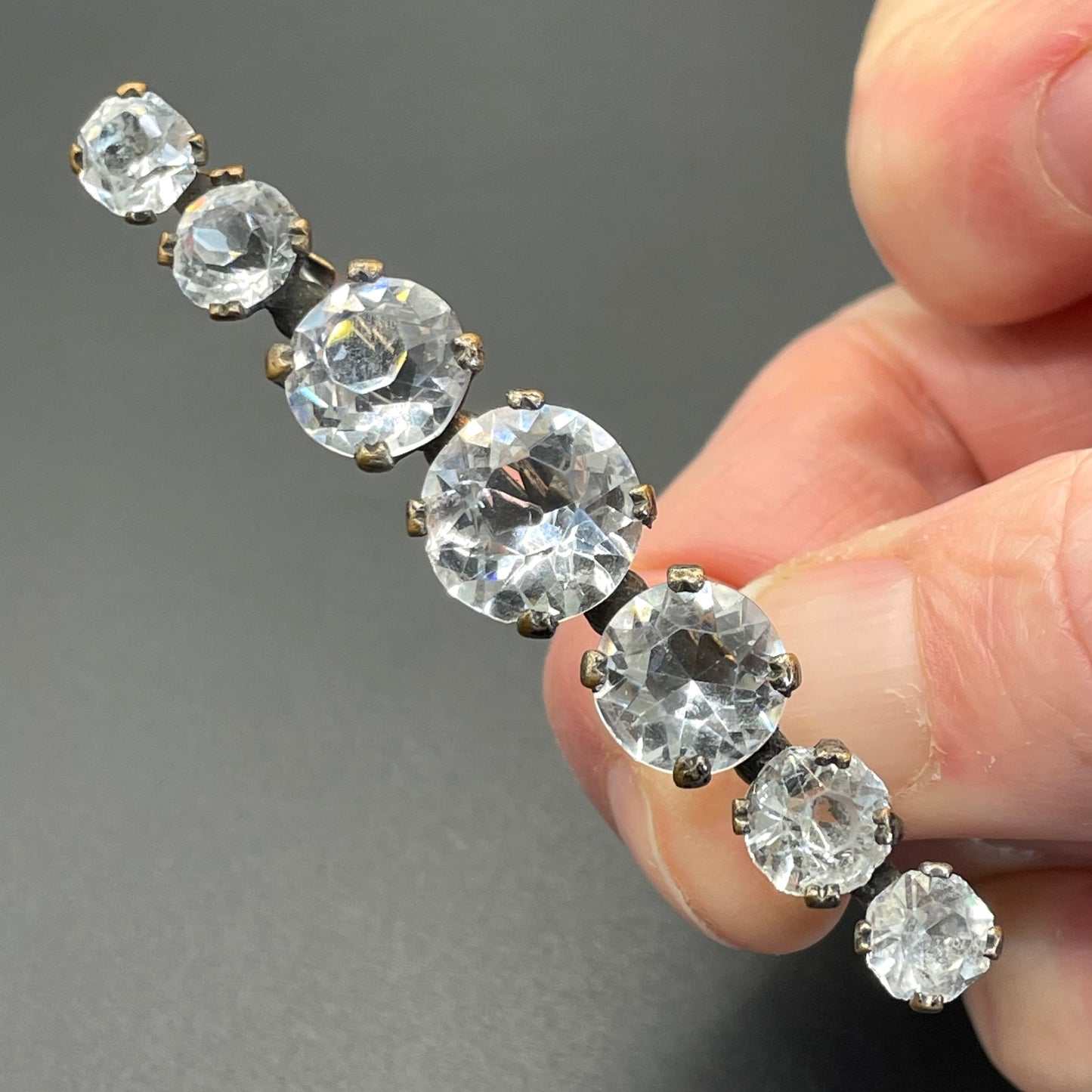 Vintage Art Deco bezel set clear crystal riviere rhinestone bar brooch, open-backed rhinestones in antique gold tone