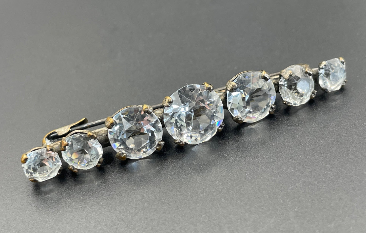 Vintage Art Deco bezel set clear crystal riviere rhinestone bar brooch, open-backed rhinestones in antique gold tone