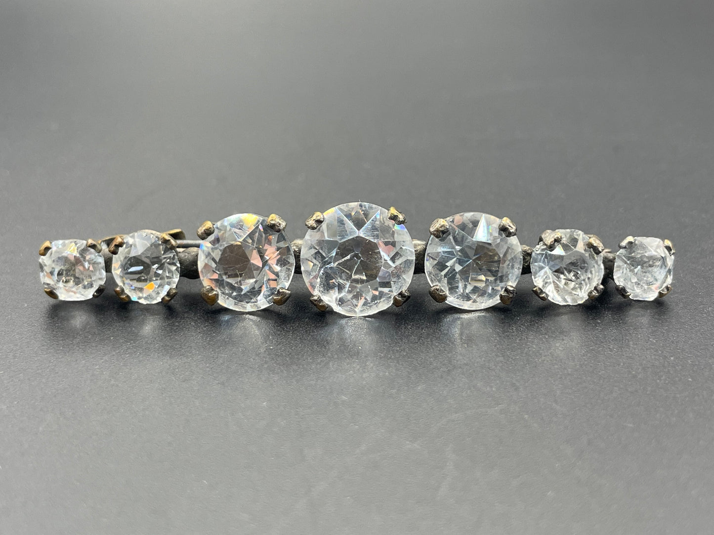 Vintage Art Deco bezel set clear crystal riviere rhinestone bar brooch, open-backed rhinestones in antique gold tone