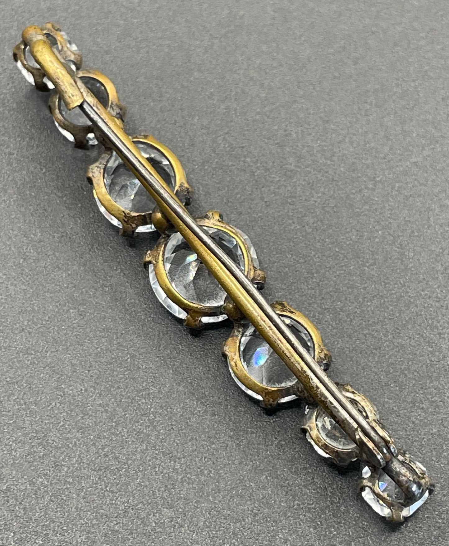 Vintage Art Deco bezel set clear crystal riviere rhinestone bar brooch, open-backed rhinestones in antique gold tone