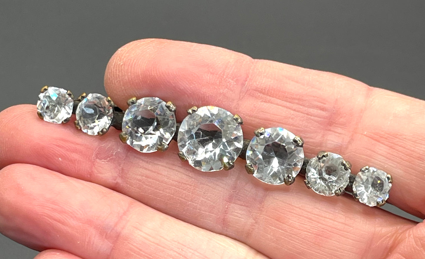 Vintage Art Deco bezel set clear crystal riviere rhinestone bar brooch, open-backed rhinestones in antique gold tone