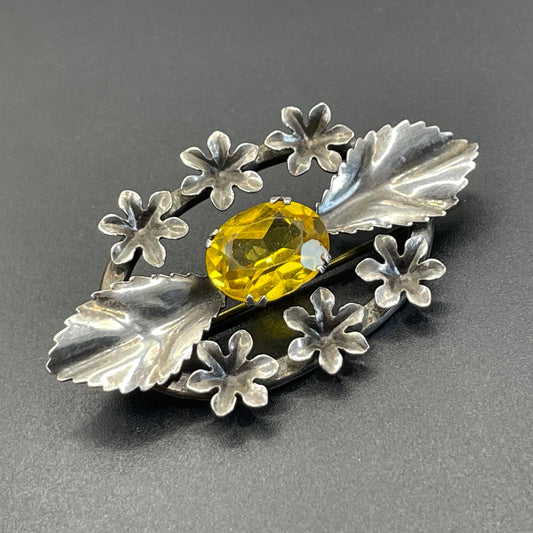 Antique sterling silver and large citrine yellow paste rhinestone brooch, pretty flower and leaf design, stamped 'SILVER', weighs 8 grams