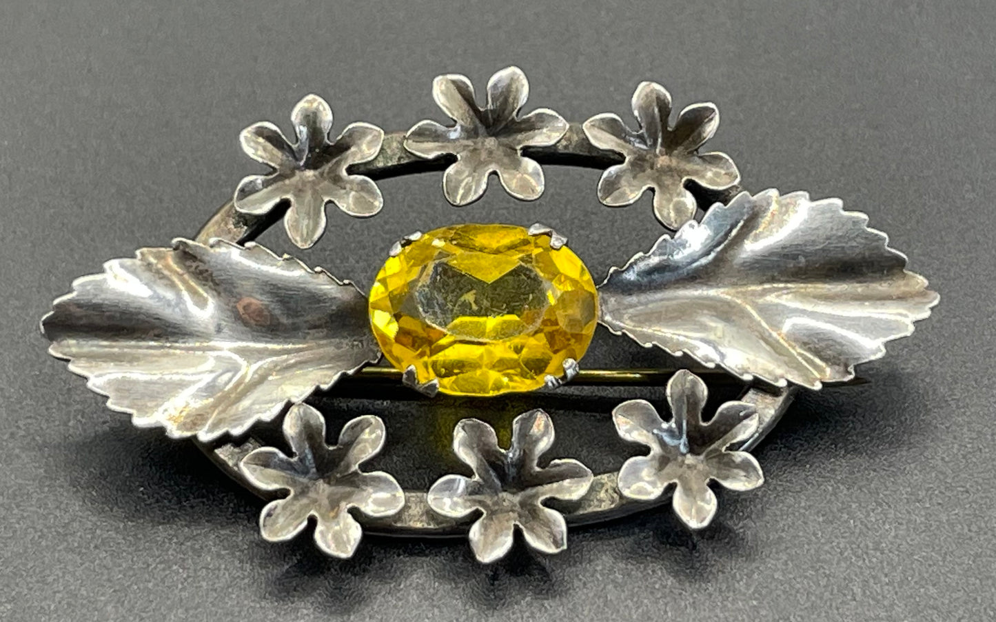 Antique sterling silver and large citrine yellow paste rhinestone brooch, pretty flower and leaf design, stamped 'SILVER', weighs 8 grams