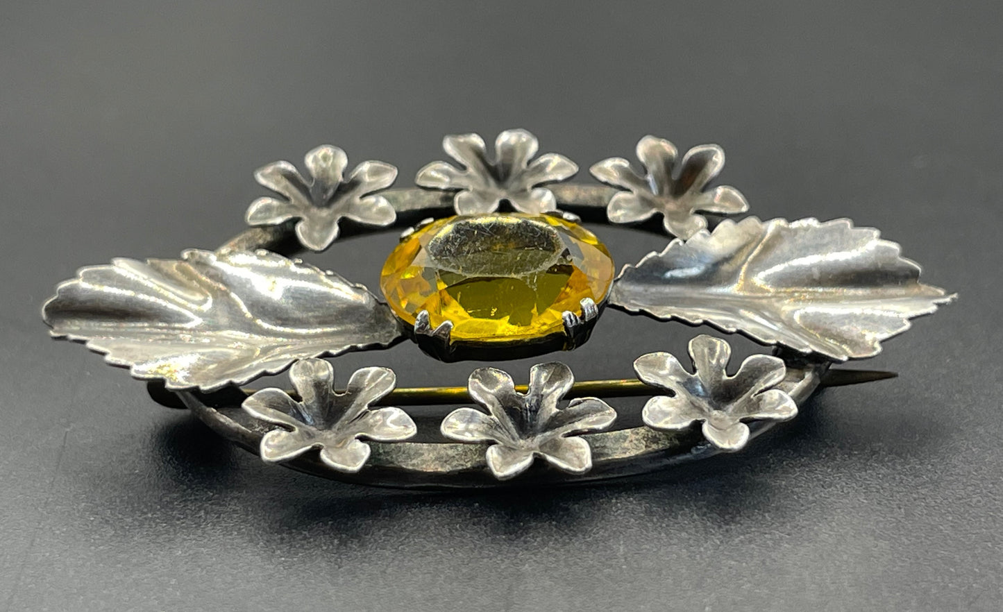 Antique sterling silver and large citrine yellow paste rhinestone brooch, pretty flower and leaf design, stamped 'SILVER', weighs 8 grams