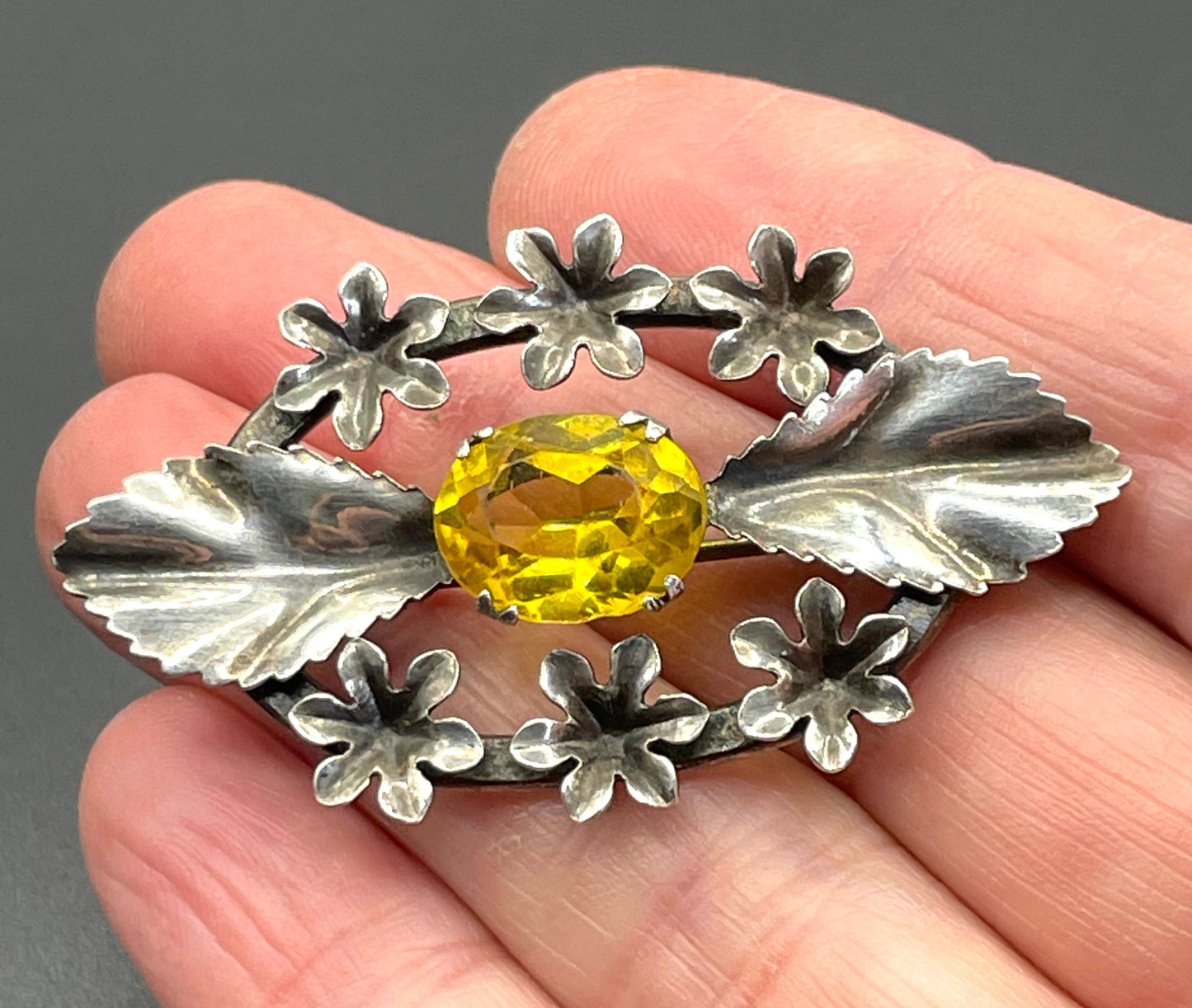 Antique sterling silver and large citrine yellow paste rhinestone brooch, pretty flower and leaf design, stamped 'SILVER', weighs 8 grams