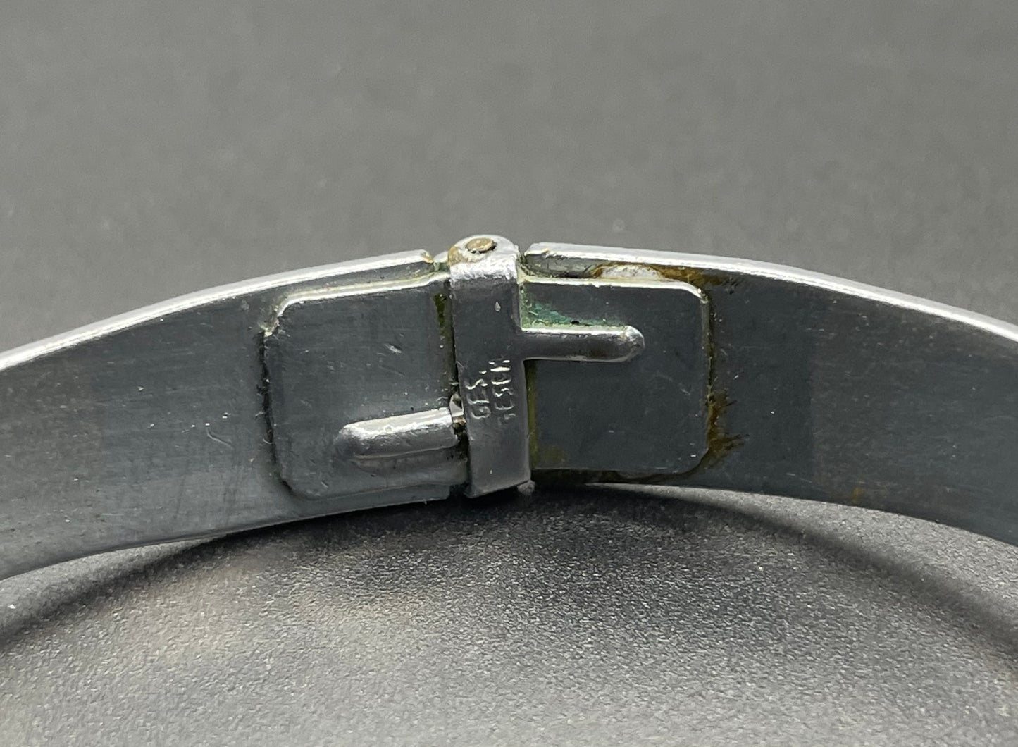 Vintage Neiger brothers sapphire blue rhinestone ornate Art Deco hinged clamper bangle set in silver tone with black enamel accents