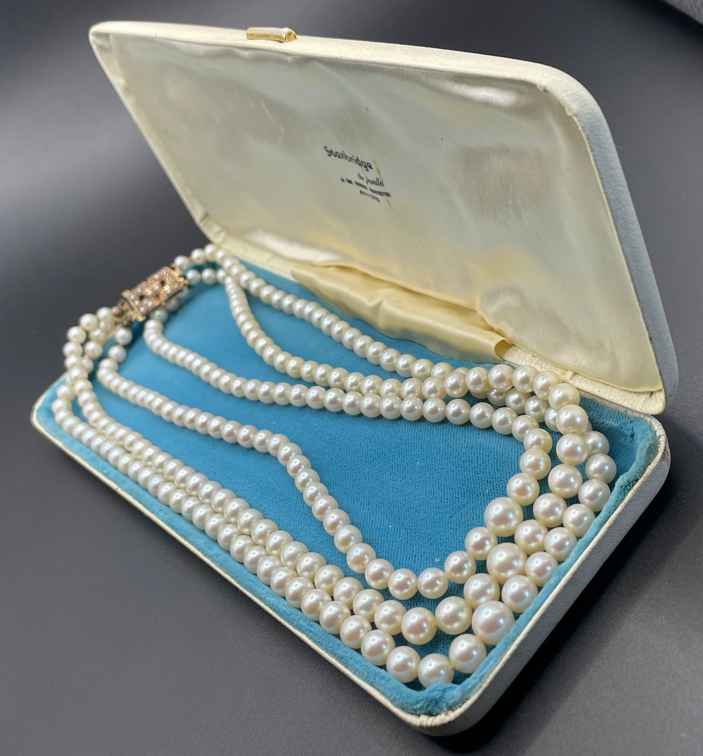 Antique real cultured 5mm pearl triple strand necklace in presentation box with pretty 9ct gold and cultured pearl cabochon clasp, 62 grams