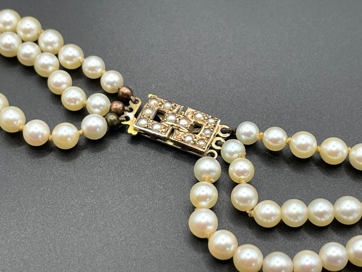 Antique real cultured 5mm pearl triple strand necklace in presentation box with pretty 9ct gold and cultured pearl cabochon clasp, 62 grams