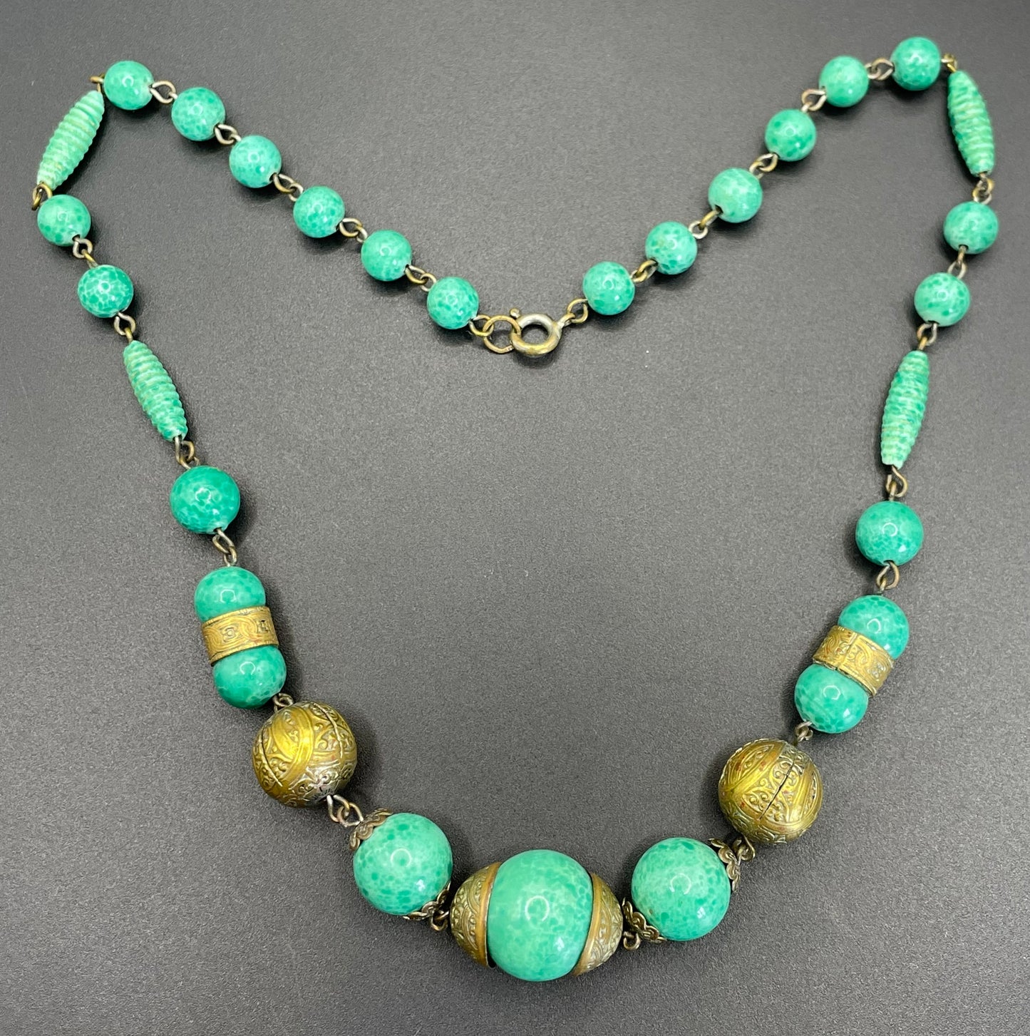Vintage Louis Rousselet Art Deco green Peking style glass and ornate gold tone bead necklace, wired moulded glass beads