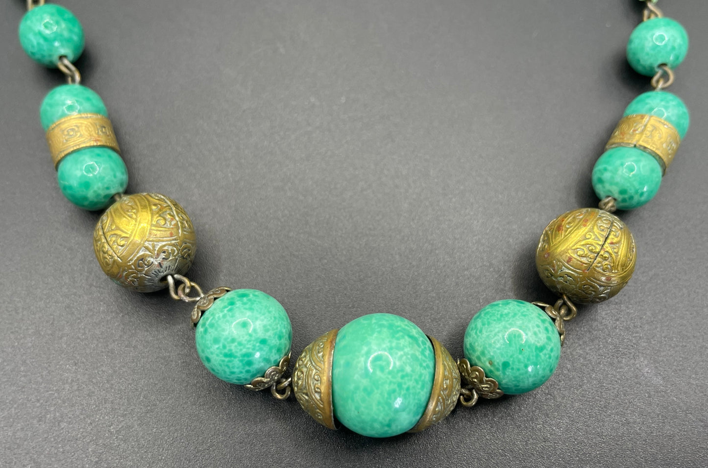 Vintage Louis Rousselet Art Deco green Peking style glass and ornate gold tone bead necklace, wired moulded glass beads