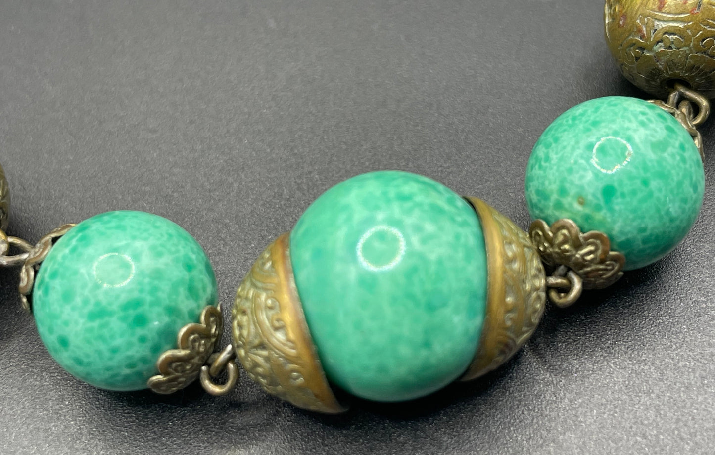 Vintage Louis Rousselet Art Deco green Peking style glass and ornate gold tone bead necklace, wired moulded glass beads