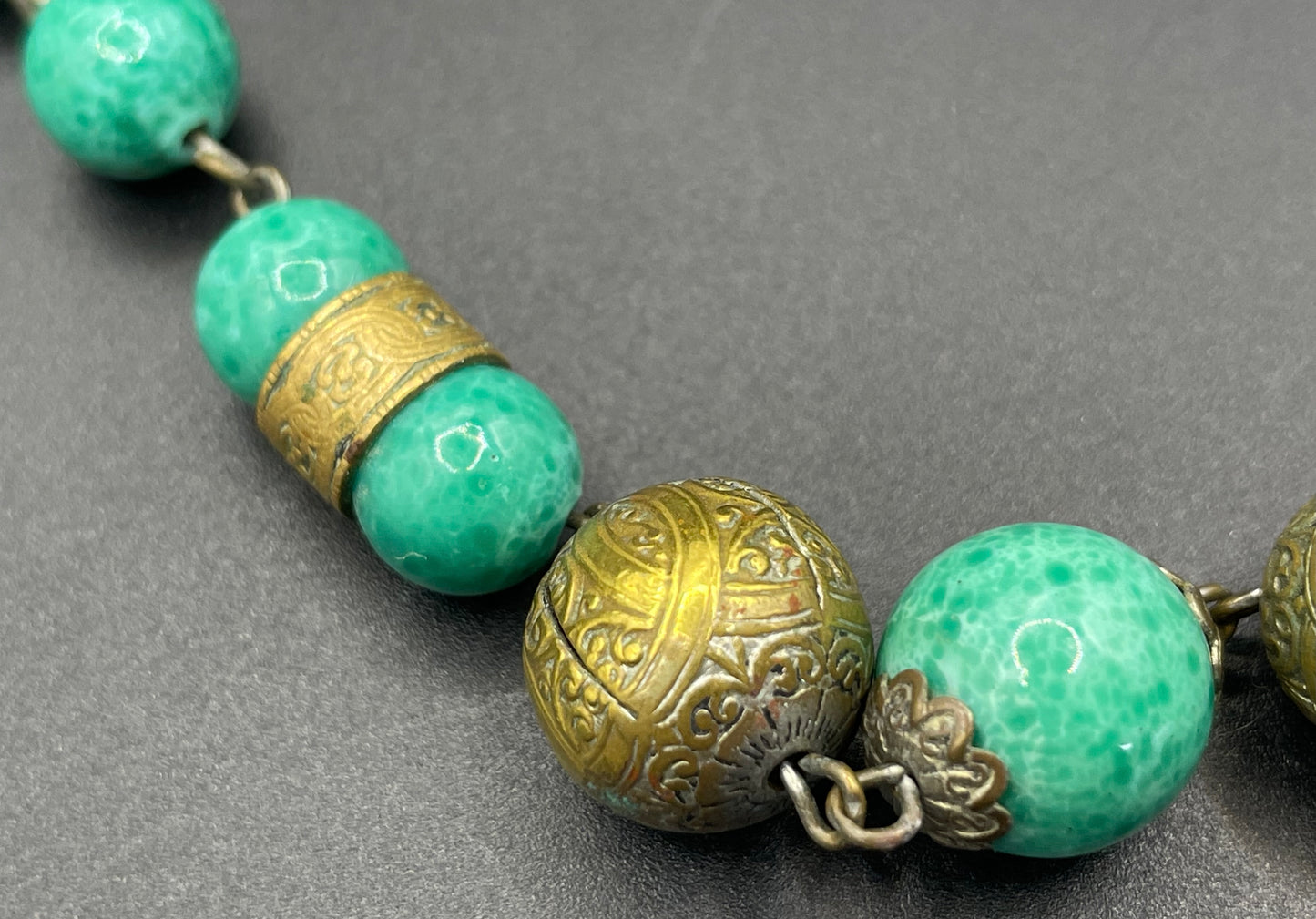 Vintage Louis Rousselet Art Deco green Peking style glass and ornate gold tone bead necklace, wired moulded glass beads