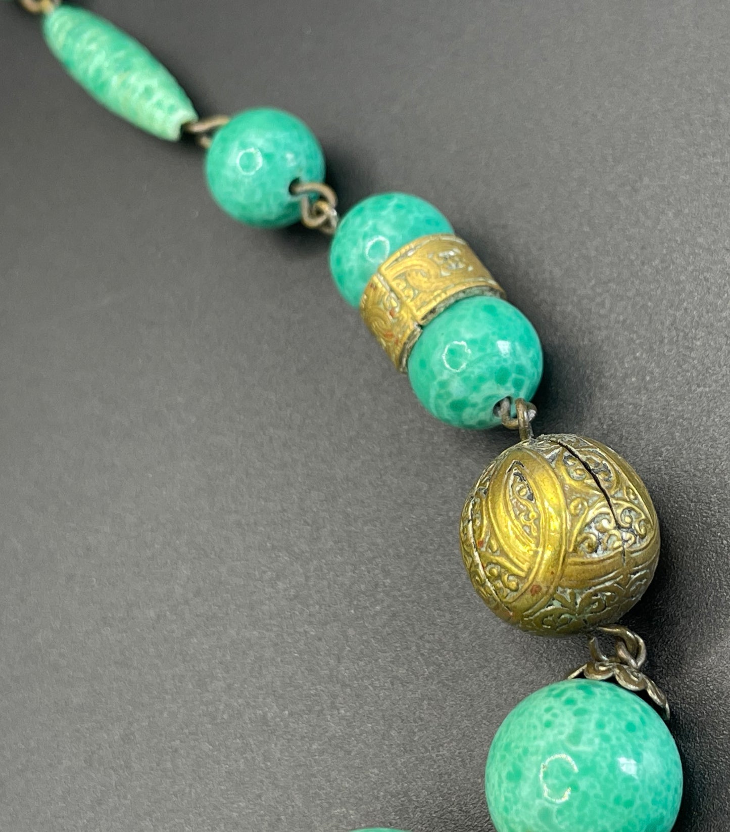 Vintage Louis Rousselet Art Deco green Peking style glass and ornate gold tone bead necklace, wired moulded glass beads