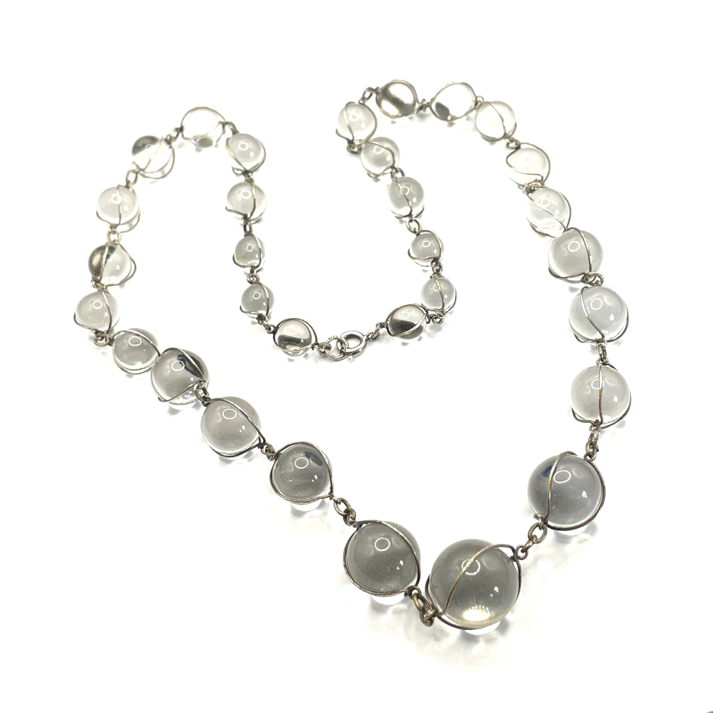 Antique 'pools of light' longer length necklace with undrilled rock crystal orbs in silver tone wire cage settings