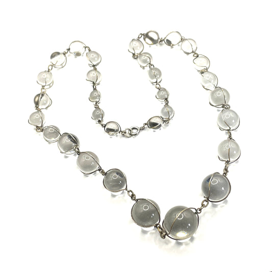 Antique 'pools of light' longer length necklace with undrilled rock crystal orbs in silver tone wire cage settings
