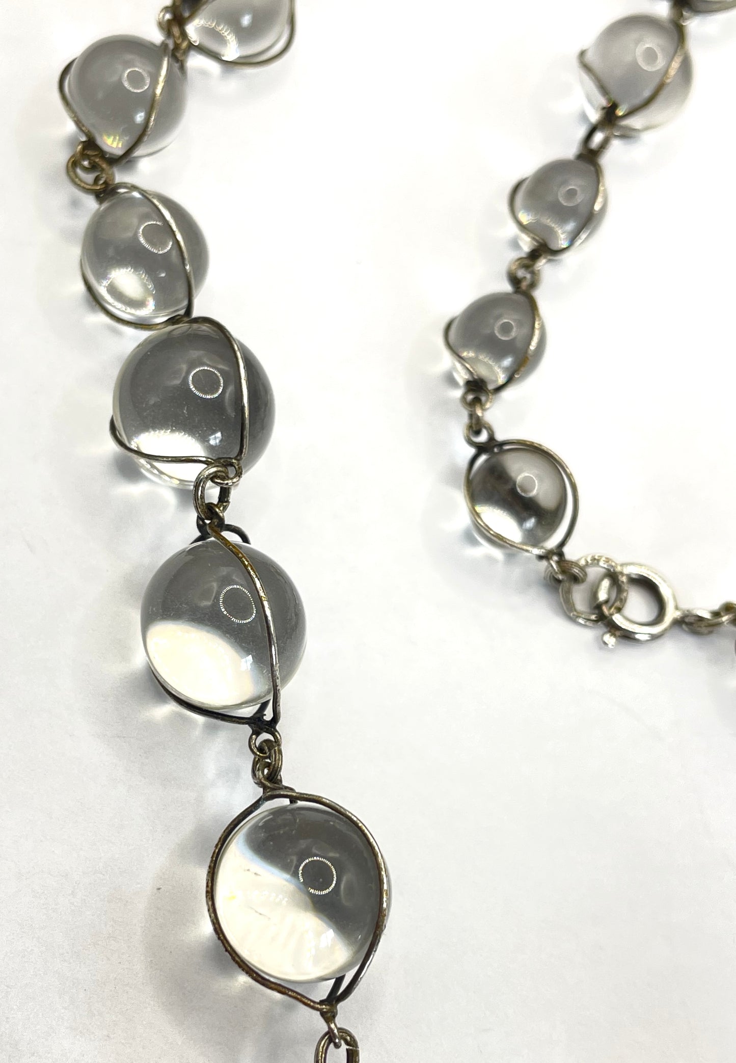 Antique 'pools of light' longer length necklace with undrilled rock crystal orbs in silver tone wire cage settings