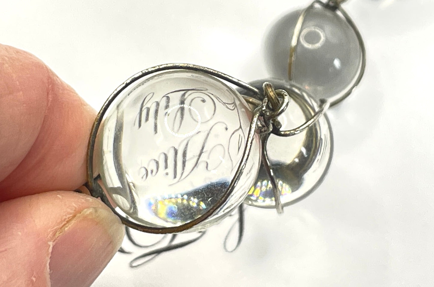 Antique 'pools of light' longer length necklace with undrilled rock crystal orbs in silver tone wire cage settings