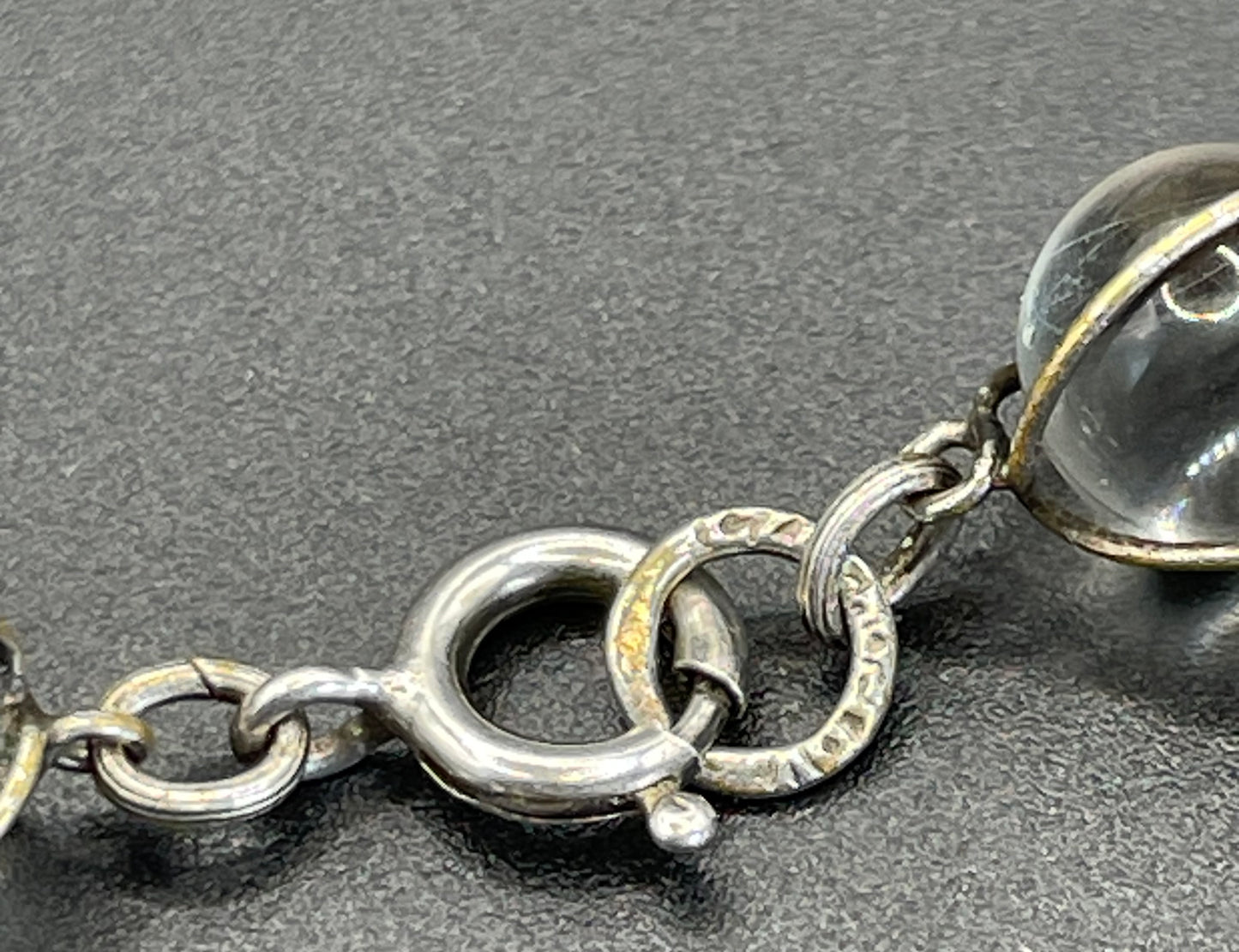 Antique 'pools of light' longer length necklace with undrilled rock crystal orbs in silver tone wire cage settings