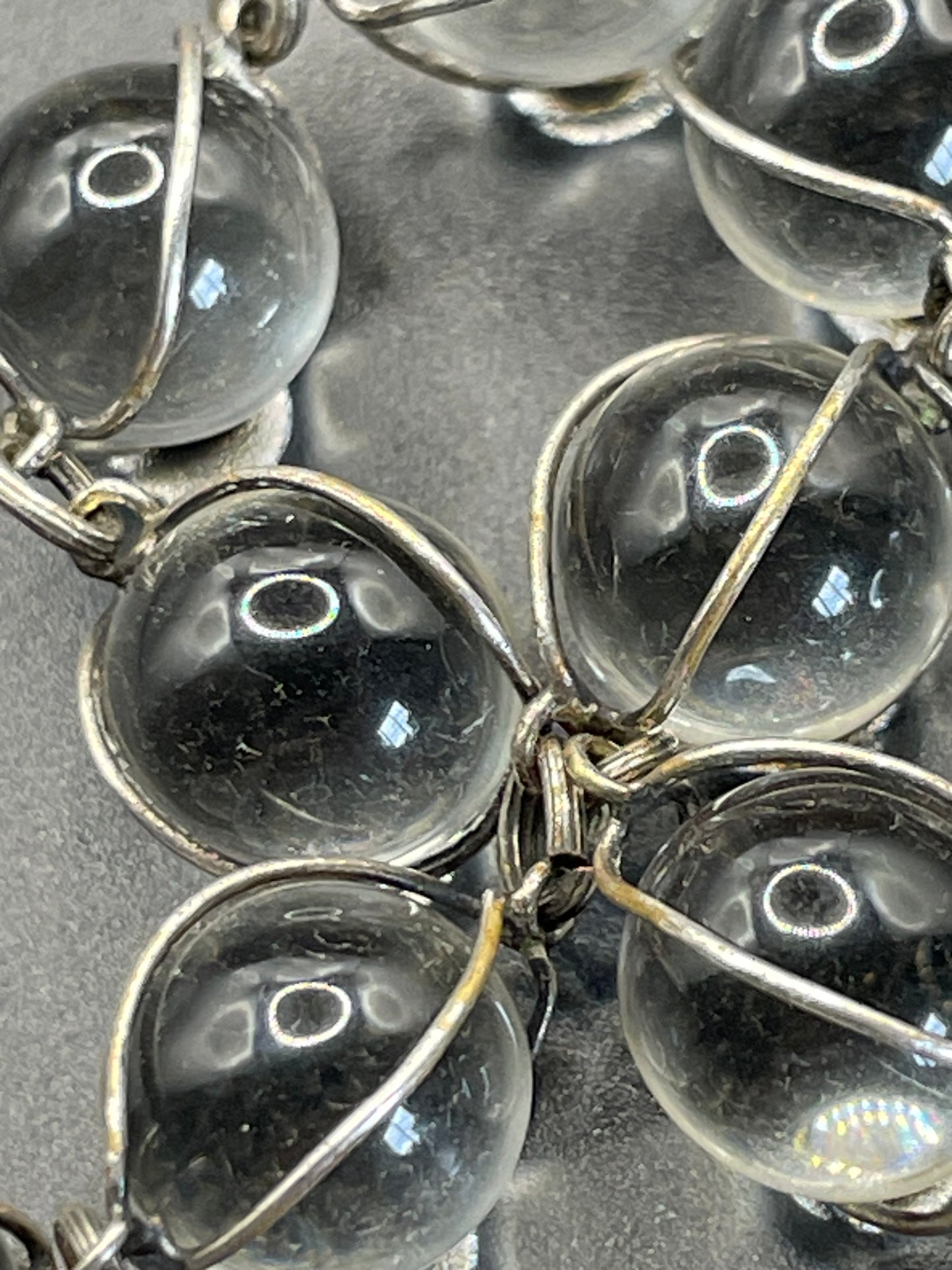 Antique 'pools of light' longer length necklace with undrilled rock crystal orbs in silver tone wire cage settings