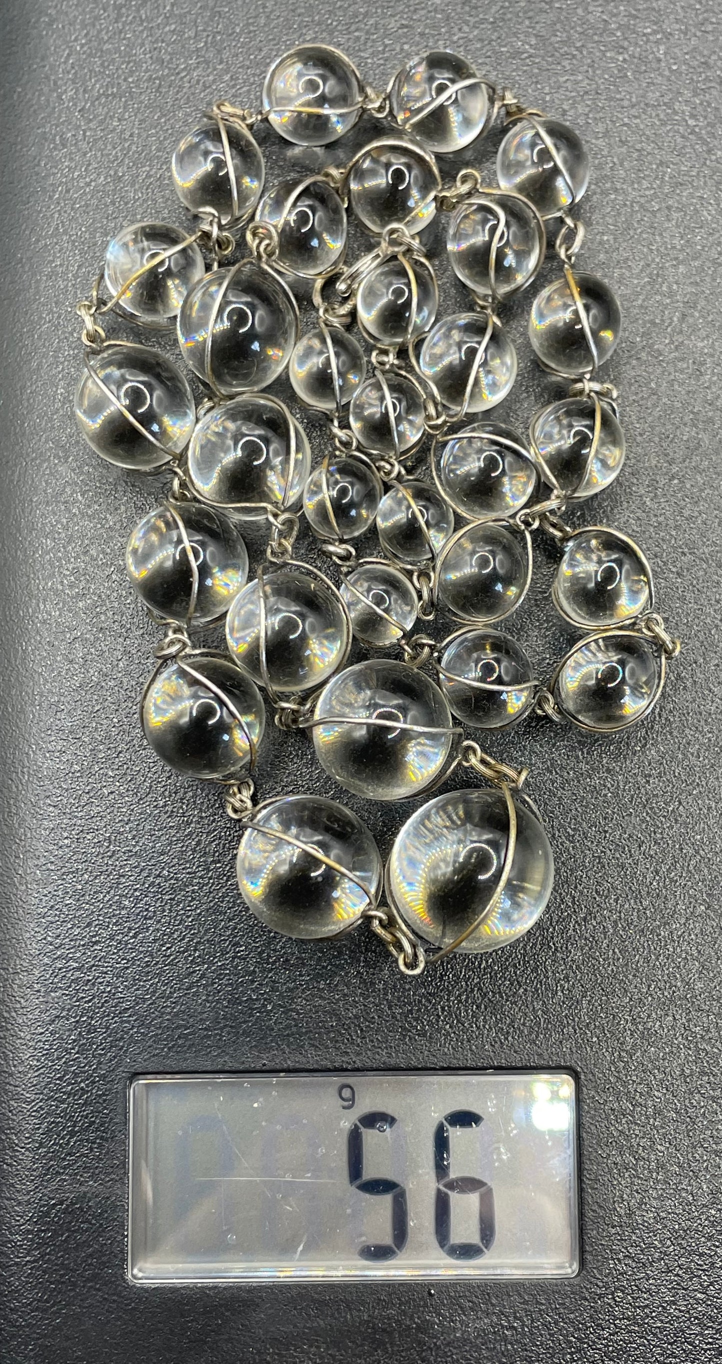 Antique 'pools of light' longer length necklace with undrilled rock crystal orbs in silver tone wire cage settings