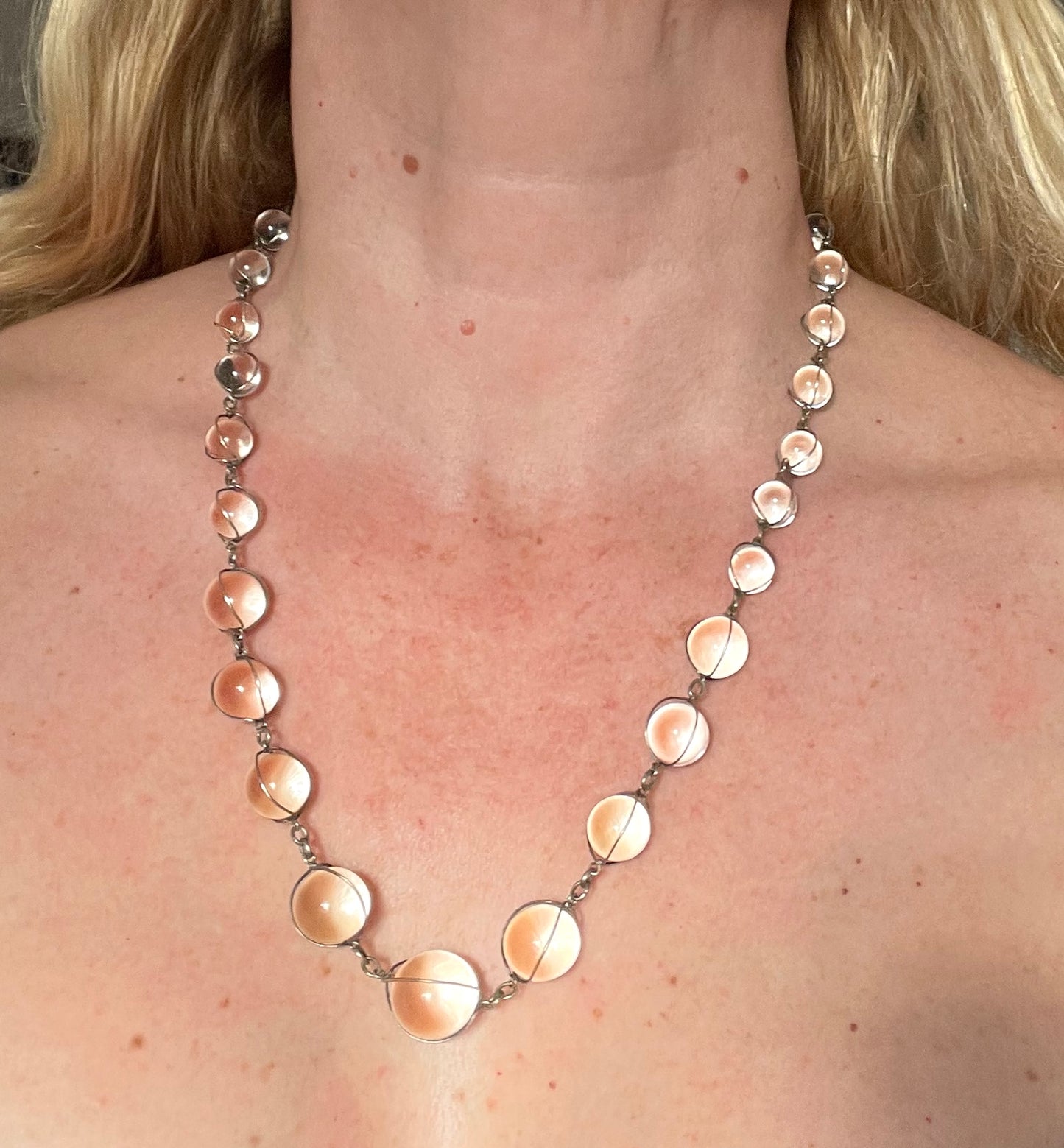 Antique 'pools of light' longer length necklace with undrilled rock crystal orbs in silver tone wire cage settings