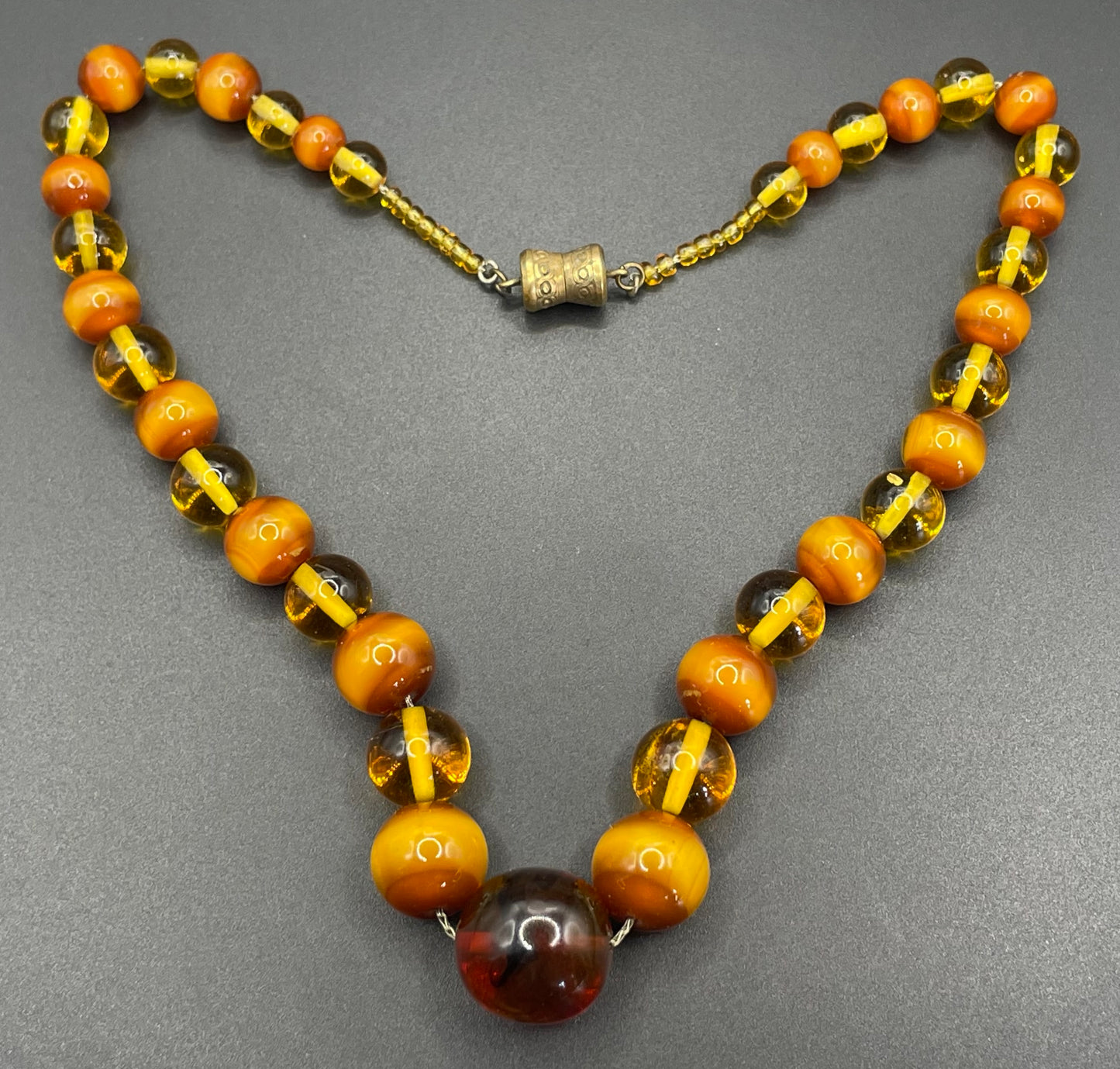 Vintage Louis Rousselet uranium glass Art Deco necklace on foxtail chain - cats' eye UV sensitive and transparent orange beads