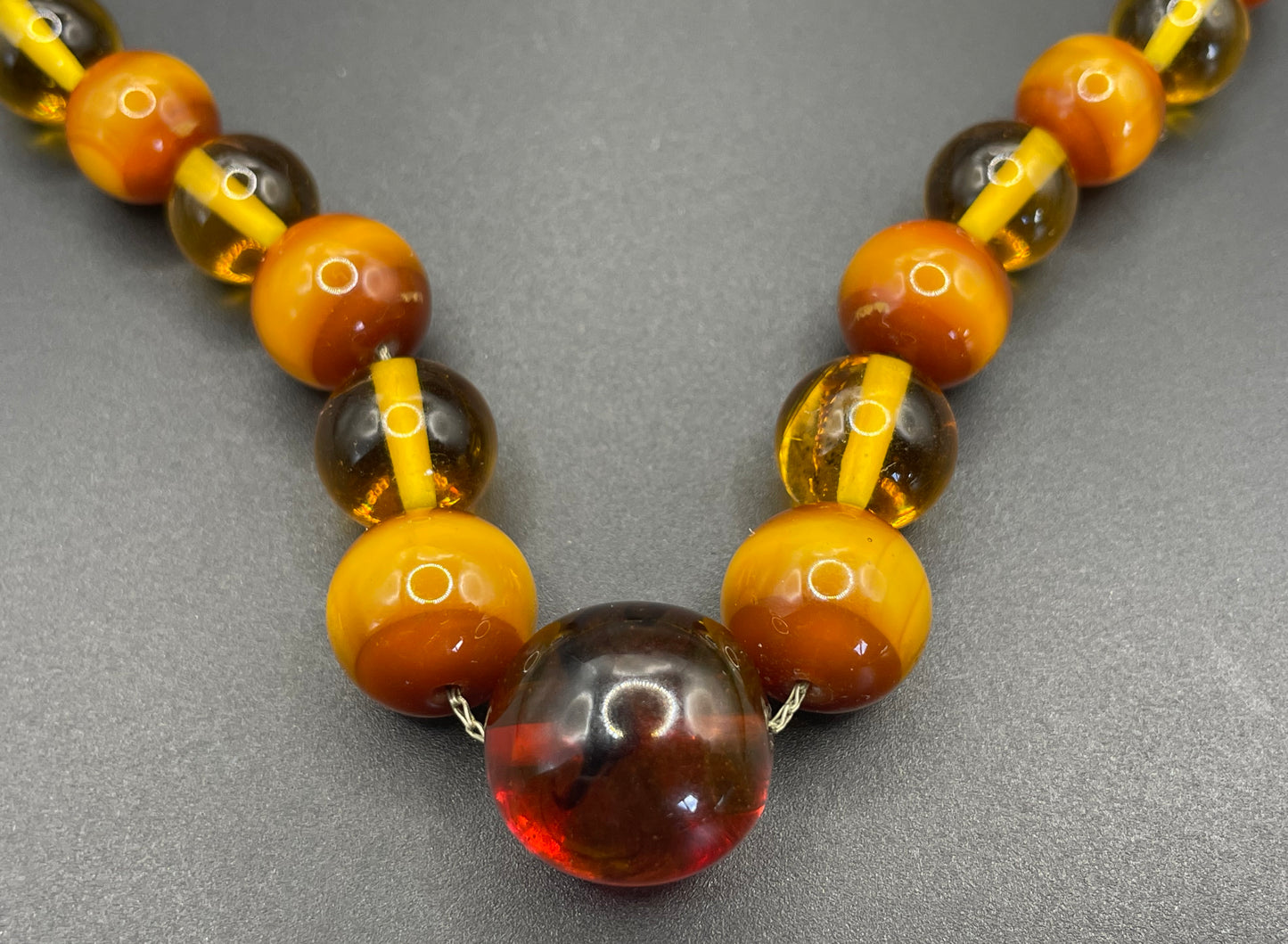 Vintage Louis Rousselet uranium glass Art Deco necklace on foxtail chain - cats' eye UV sensitive and transparent orange beads