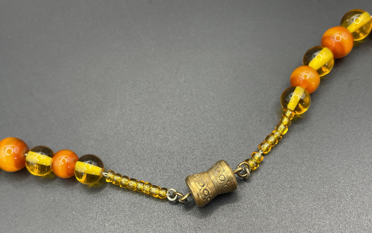Vintage Louis Rousselet uranium glass Art Deco necklace on foxtail chain - cats' eye UV sensitive and transparent orange beads