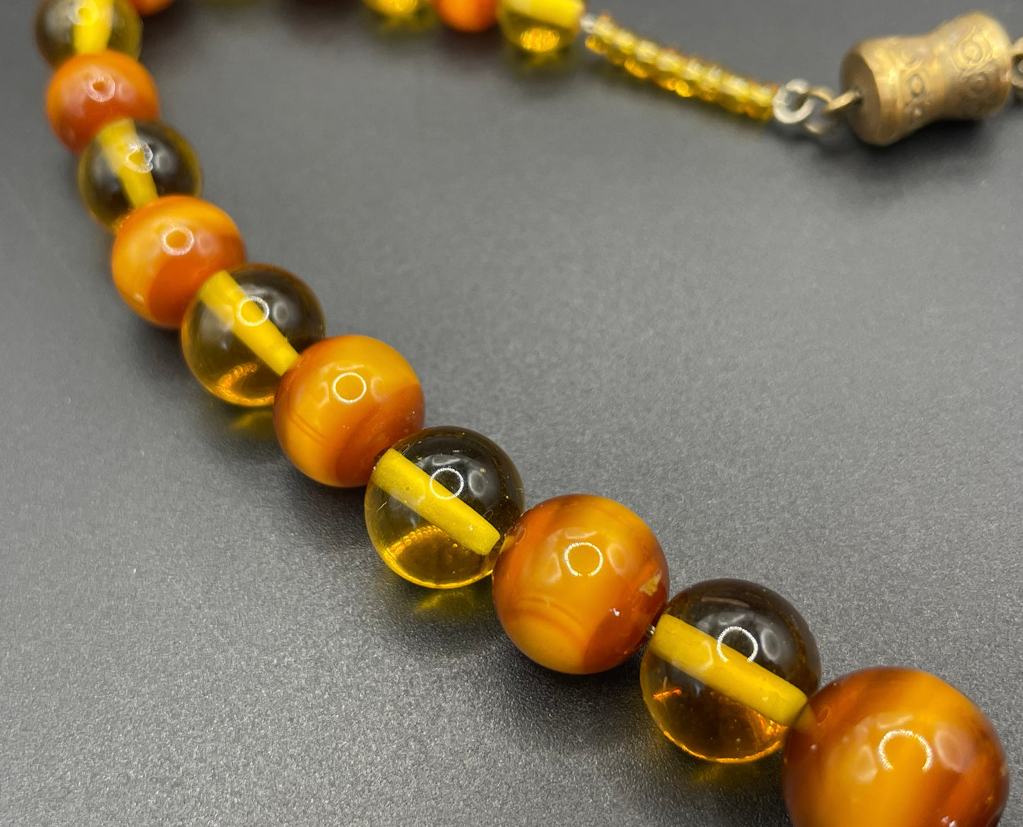Vintage Louis Rousselet uranium glass Art Deco necklace on foxtail chain - cats' eye UV sensitive and transparent orange beads