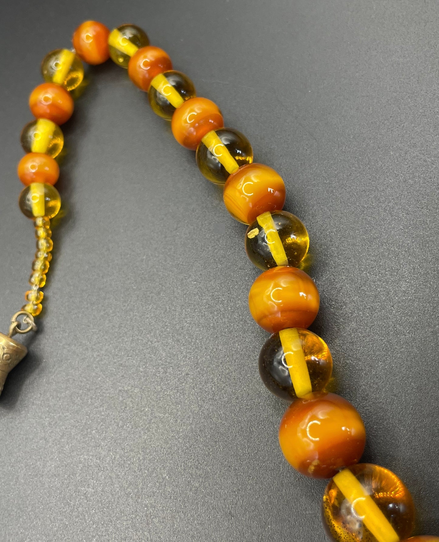 Vintage Louis Rousselet uranium glass Art Deco necklace on foxtail chain - cats' eye UV sensitive and transparent orange beads