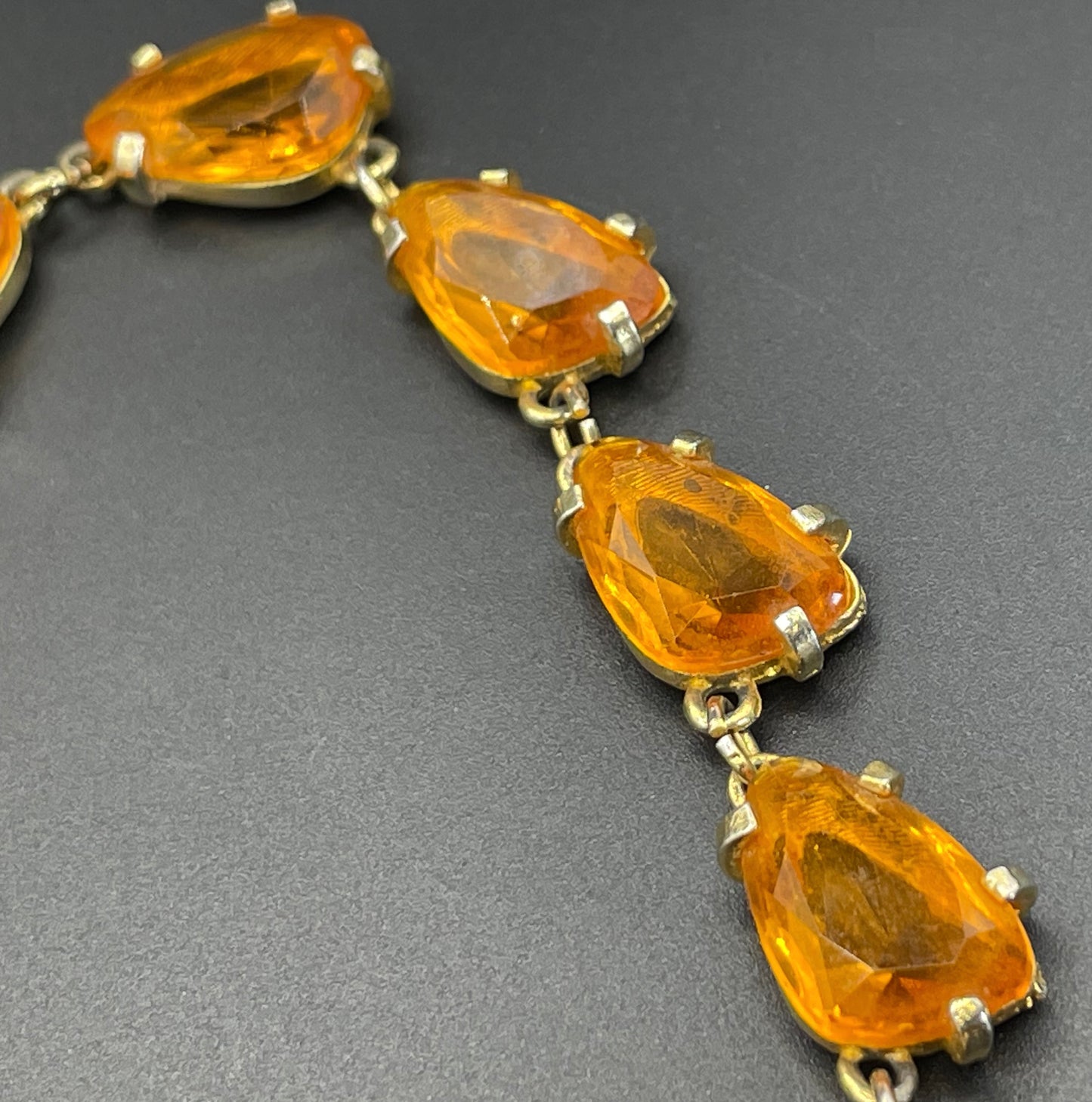 Vintage signed Sphinx citrine yellow / topaz orange glass riviere necklace, triangle shaped crystals set open-backed in gold tone settings